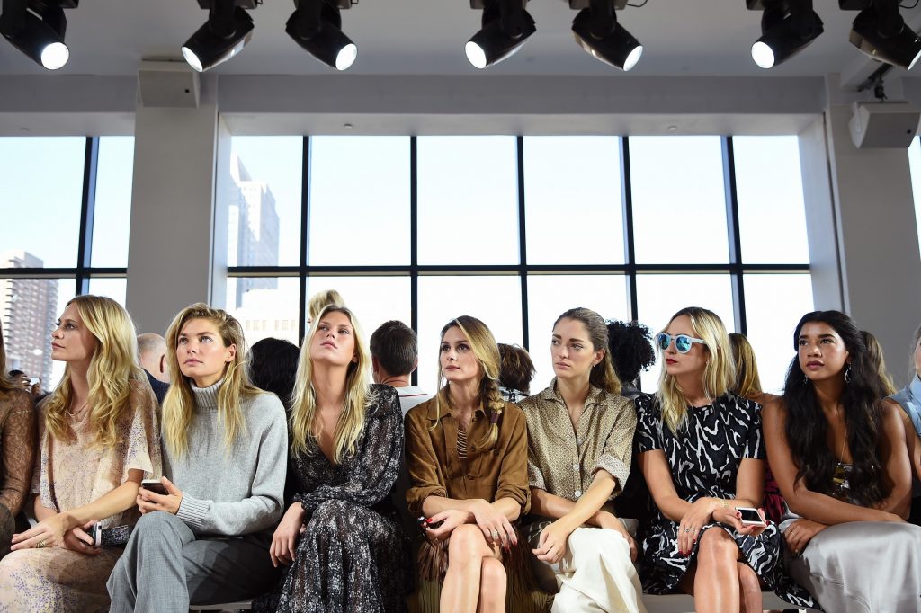 Sitting front row at Burberry SS15, photographed by Getty.