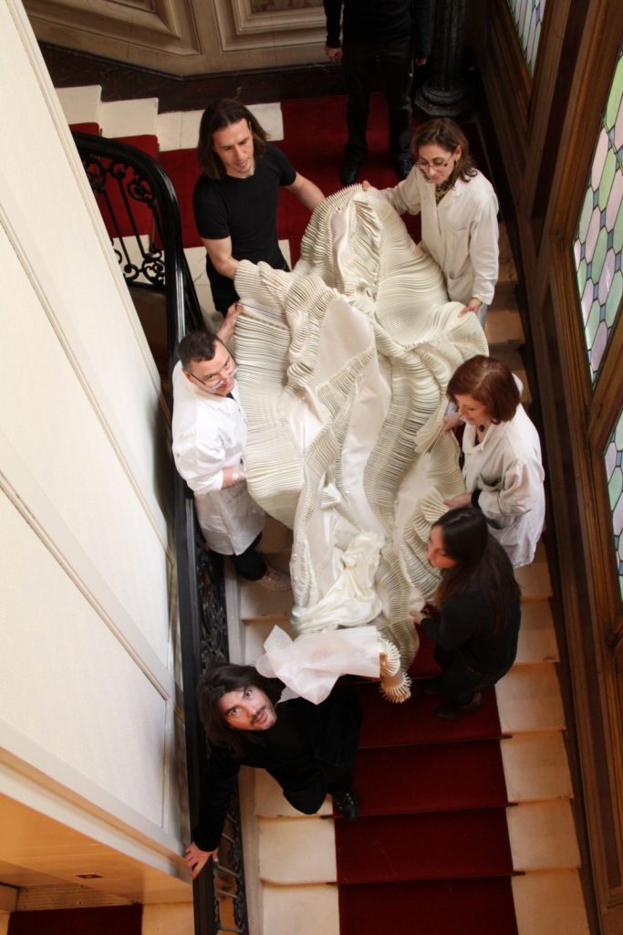 Transporting the gown at Stéphane Rolland's atelier