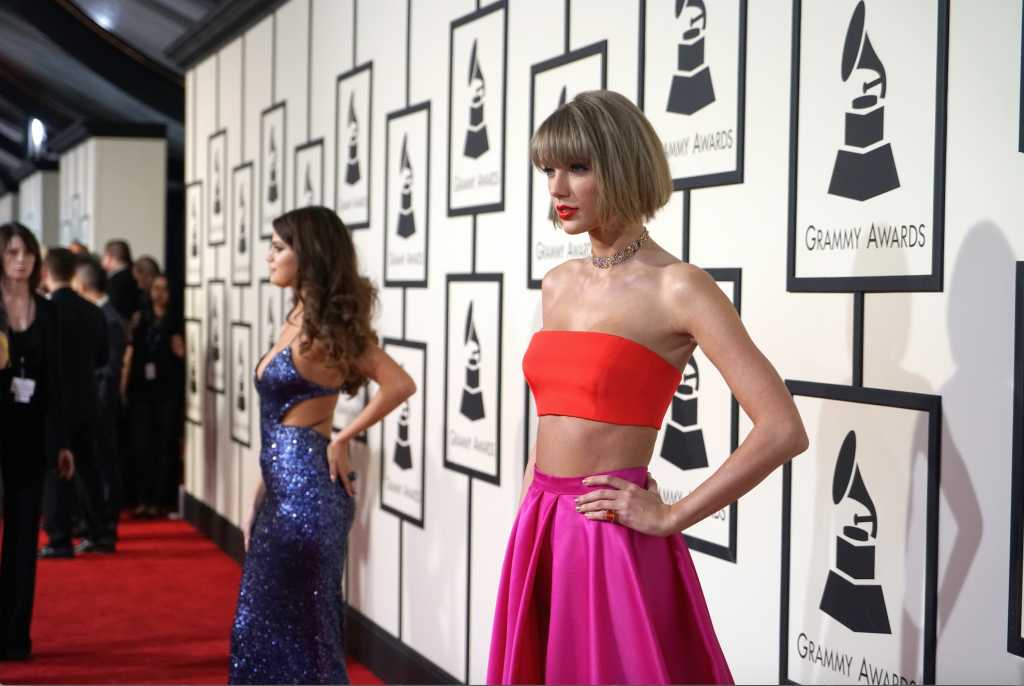 Selena Gomez and Taylor Swift attend The 58th GRAMMY Awards. Photo by Kevin Mazur/GettyImages