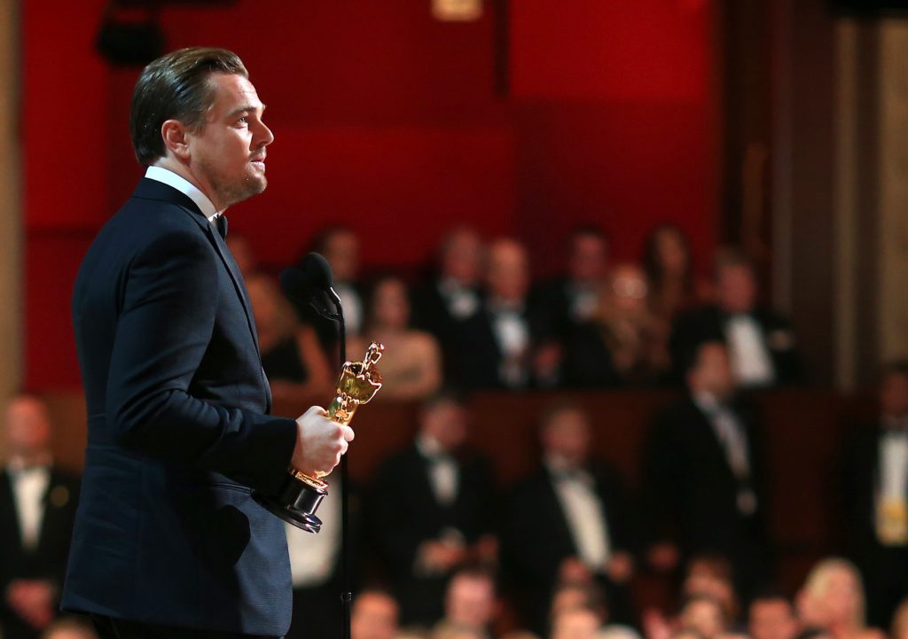 Actor Leonardo DiCaprio accepts the Best Performance by an Actor in a Leading Role award for The Revenant onstage during the 88th Annual Academy Awards