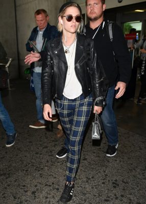 Kristen Stewart ticked off every punk sartorial staple for her arrival at Cannes. A biker jacket, tartan trousers, and well-worn sneakers paired with a Chanel backpack, off course.