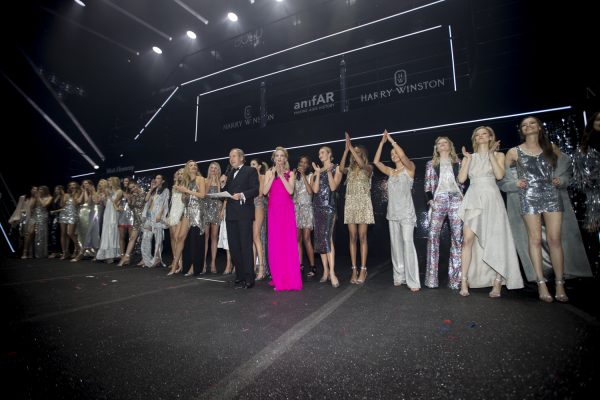 Models walk the runway at dazzling Disco Collection fashion show curated by longtime amfAR supporter Carine Roitfeld.