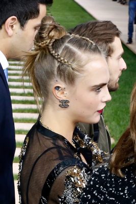 Best for: Day-to-night | Cara takes her bun to a new level of cool with the addition of three micro-plaits taken from the front. This style can transition easily between office and evening affairs