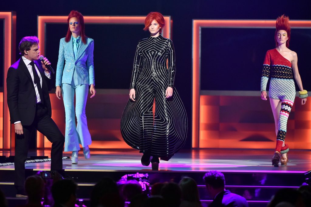Michael C. Hall performs a tribute to David Bowie as models display fashions onstage at the 2016 CFDA Fashion Awards