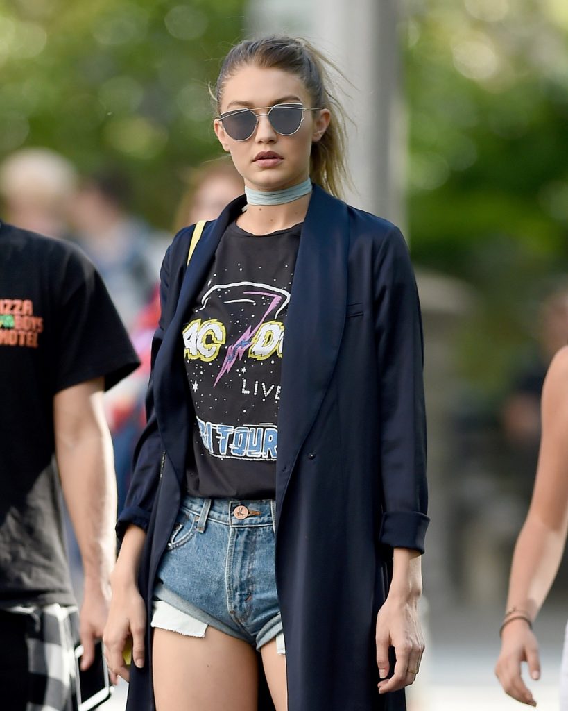 AC/DC fan Gigi Hadid revealed her inner rockstar in true supermodel style by teaming her vintage tee with short shorts and a tailored blazer, adding a bit of edge to the casual outfit.