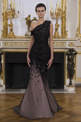 Discreet evening gowns and masquerade silhouettes feature gradually exploding geometric patterns that enhance curves