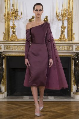 Sculptural folding and satin layers add drama to a soft, yet rich, colour palette of plum, amethyst and burgund