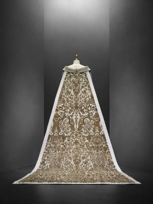 This 2014 Haute Couture wedding dress by Karl Lagerfeld for Chanel with a 20-foot train occupied a central cocoon, with details of its embroidery projected onto the domed ceiling. © The Metropolitan Museum of Art/Nicholas Alan Cope