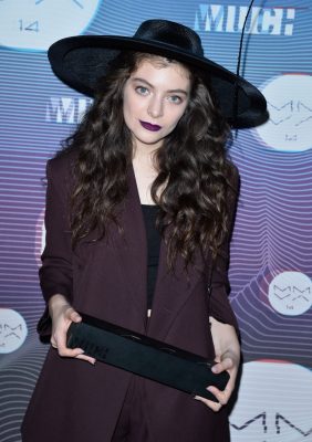 New Zealand singer-songwriter Lorde poses in the press room with a bold purple lip. Defined brows and lots of mascara pair well with such an audacious colour. Choose a light eyeshadow to prevent stealing focus from a loud pout