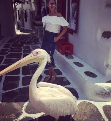 Olivia Palermo gets friendly with the locals in Mykonos. (Image courtesy of @oliviapalermo)