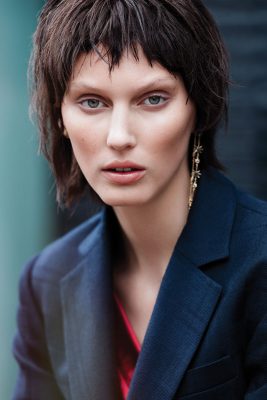 Jacket and blouse, VIVIENNE WESTWOOD | Earrings, SWAROVSKI