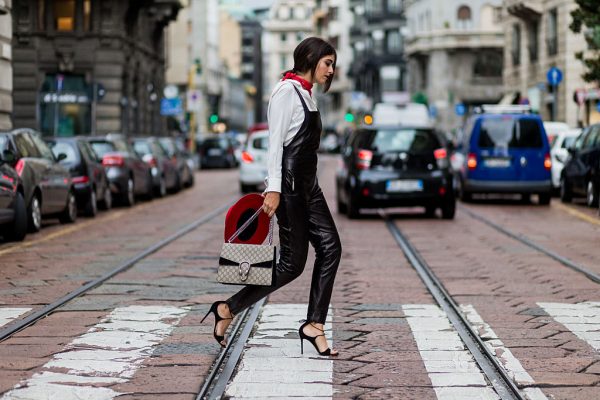 Nour Arida pairs a crisp tailored shirt with a leather Saint Laurent jumpsuit.