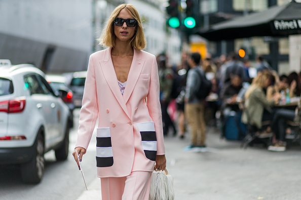 Candela Novembre wears a powder pink pantsuit to the Max Mara show.