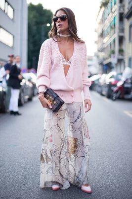 Annacarla dall'Avo pairs her sheer flared trousers with a plunging knit.