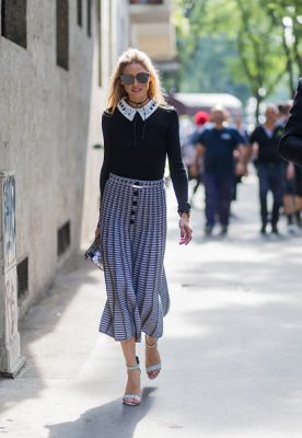 Olivia Palermo looks polished in a collared knit and midi skirt enroute way to the Armani show.