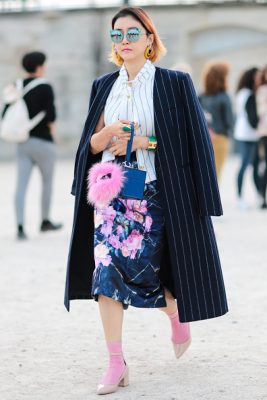 A guest clashes florals and stripes on Day One of PFW.