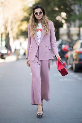 Doina Ciobanu makes her way between shows in a pink suit on Day Two of PFW.