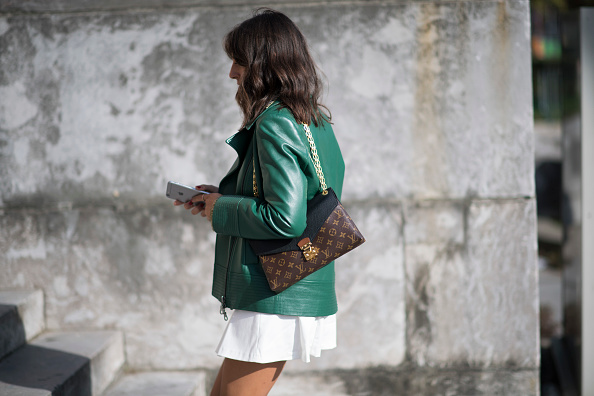 Nil Nina dons a green Kenzo leather jacket on Day Two of PFW.