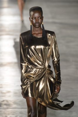 Saint Laurent's liquid gold lamé dress will look just as good with white sneakers or statement heels.