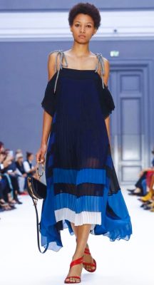 Chloe's pleated off-shoulder gown is the epitome of easy summer dressing.