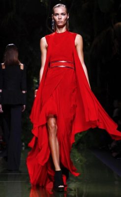 Balmain's ruby red layered gown exudes dramatic luxury