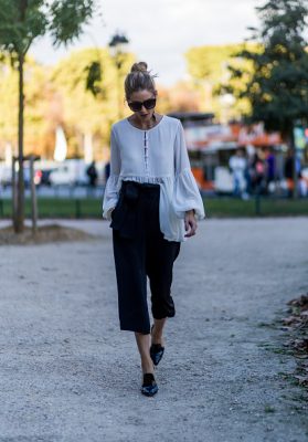 Olivia Palermo pairs a floaty blouse with cropped trousers on Day three of PFW.