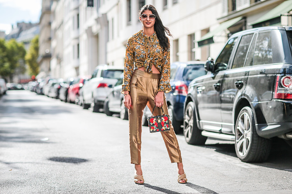 Melanie Darmon wears copper tones from head-to-toe outside the Valentino show.