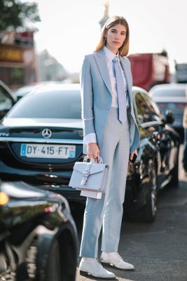 Veronika Heilbrunner dons a baby blue masculine suit outside the Chanel show.