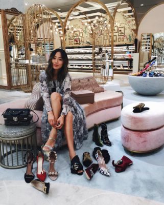 Spending her day in a shoe lover’s dream, Song switches between designer footwear at Level Shoe District while donning an effortless long-sleeve maxi. Image courtesy of @songofstyle