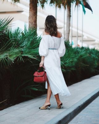 Follow Song's lead and invest in a range of midi dresses for the season ahead. Opt for a clean palette of white for its timeless appeal and select styles that offer a touch of drama, such as an exaggerated sleeve. Image courtesy of @songofstyl