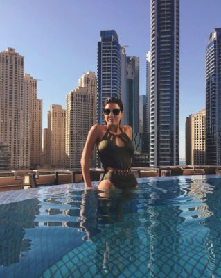 Mirsaleh enjoying the Middle Eastern sun in a khaki one-piece. Image courtesy of @negin_mirsaleh