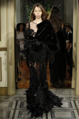 Alberta Ferretti: Dark, moody elegance enveloped the show that displayed three collections seamlessly. Feathers fell at the floor adding essence to the laser cut creations