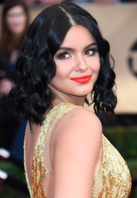 Ariel Winter. Thick mermaid waves parted at the centre, a bronze glow and a bright tangerine lip shade that offered just the right pop of colour. The actress let her golden Mikael D dress do the talking