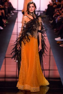 Armani Prive: Oranges of India made their mark on this collection that took inspiration from far-flung locales. Turmeric toned gown took on a tropical feel with sharp, structural feathers that remind us of birds of paradise