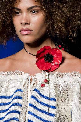 The Floral Necklace – Jean Paul Gaultier: Powerful outsized poppies poked out amongst Jean Paul Gaultier’s collection. Worn loosely around the neck, the bright red blooms make a refreshing change from the light and delicate florals we have seen in past seasons
