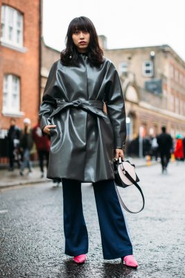 A glossy grey coat pairs perfectly with navy flares and pink mules.