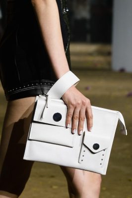 Phillip Lim’s two pocketed, tabbed clutch is cut with architectural precision and is both work and evening friendly making for easy compartmentalisation while remaining supremely chic.