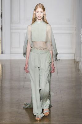 Maison Valentino: Proposing a largely pared back palette of muted pastel greens, pinks, yellows and lilac, Maison Valentino played it safe with chiffon gowns decorated with tiny garden flower prints. Standout pieces came in the form of gleaming fuchsia pink pleated lame gowns and pretty green pastel trouser suits elevated with a sheer chiffon top and ground grazing cape