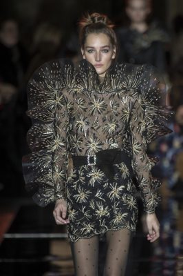 Zuhair Murad: A marriage of Japanese pyrotechnics and eighties opulence, hemlines were seriously short and adornment levels were high. Thigh high slits and theatrical ruffles met metallic and sculpted shoulders