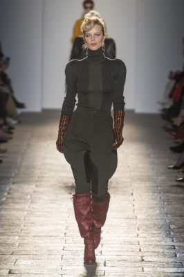 Bottega Veneta: Forties-inspired Hollywood glamour was particularly luxurious at Bottega Veneta’s autumn/winter17 show. Structured and polished ensembles were worn with dramatic, ballerina-inspired heels and sheer spotted tights. Puff-sleeved, high-waisted midi-dresses strutted down the catwalk, as did bronze-pleated vintage gowns featuring cascading black capes. Vintage, wavy locks were swept up into sophisticated up-dos.