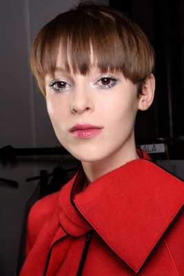 Iridescent Illumination: Emporio Armani framed the eyes with glittery silver liner. Black mascara and glossy lips completed the look.