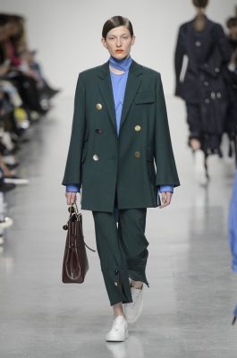 Eden Choi: Eudon Choi offered up an arsenal of new season workwear staples in captivating hues. Rich shades of green, shimmering mauve and zesty orange are bound to pack a stylish punch in a working environment.