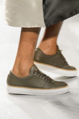Sneaker Style: Eudon Choi chose to update the classic white sneaker for autumn, opting for sleek khaki leather instead.