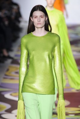 Emilio Pucci: Colour, texture and patterns were, as always, experimented with at Pucci’s runway show, seen here in acid and meadow green. Basic shapes were married to trademark vibrant prints, while eye-catching long-fringed sleeves were elegantly matched with wide tailored trousers. To top it all off, clear plastic coats mottled with sparkling crystals proved to be a real head-turner.