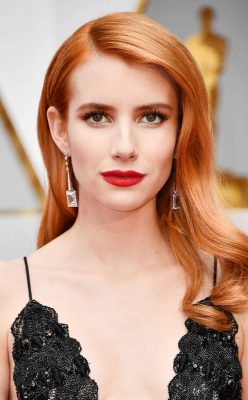 Emma Roberts. The actress showcases a constant fascination with the idea of Old Hollywood glamour and this year's Oscars were no exception. The Scream Queens star’s cherry red hair was demurely parted to the side in luscious waves and accented by a deep red lip.
