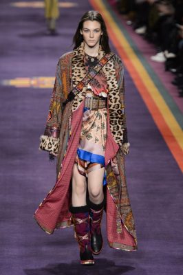 Etro: Roughly textured leather, Seventies-inspired ponchos, silk maxis and mid-length dresses were worn with geometric jewellery. Hammered silver accessories and gold-hardware embraced mid-century bohemianism, topped with patchwork puffer jackets, brocade robes and playful floral jacquard. Mandala insignias, and clashing kaleidoscopic fabrics really brought Etro's read-to-wear collection to life.