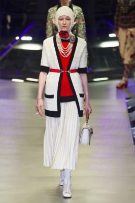 Gucci: Graphic jewellery and headwear was paired with ivory, ruby-red and champagne hues. Whimsical florals and insect-inspired motifs donned shirts and accessories, while glitter and sparkle drenched shimmering tights and funky glasses. Bold colour combinations, slogan Tees, and Far East-laden props screamed Alessandro Michele.