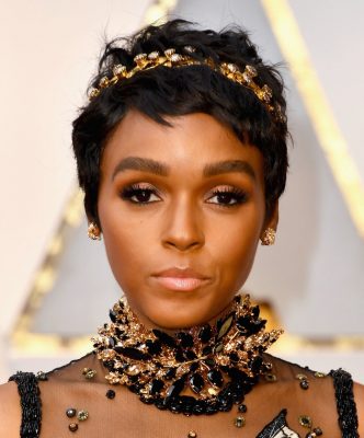 Janelle Monae. While the actress and singer is usually OTT (over the top), her unique flair for ornamentation primarily focussed on her dress this time around. Her beauty look consisted of a deep dewy highlighter, accentuated brows and lilac eyeshadow. The actress also sported her new pixie cut that served as the perfect base for a gilded crown.