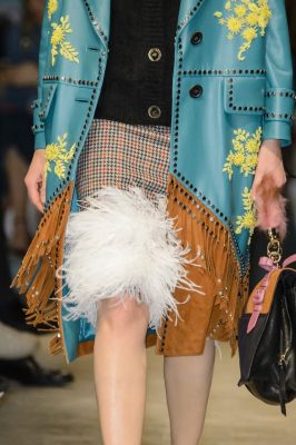 From houndstooth checks with a marabou trim to studded suede fringing, Prada mixed fabrics and prints with the panache she has become so well known for.
