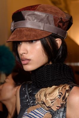 Baker boy hats in panelled leather, suede and snakeskin lent a Seventies vibe to the collection.
